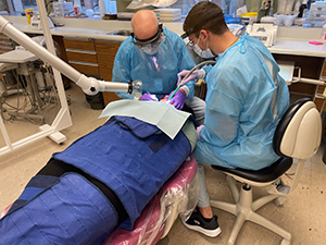  Stephen Beetstra, DDS performing checkup on patient
