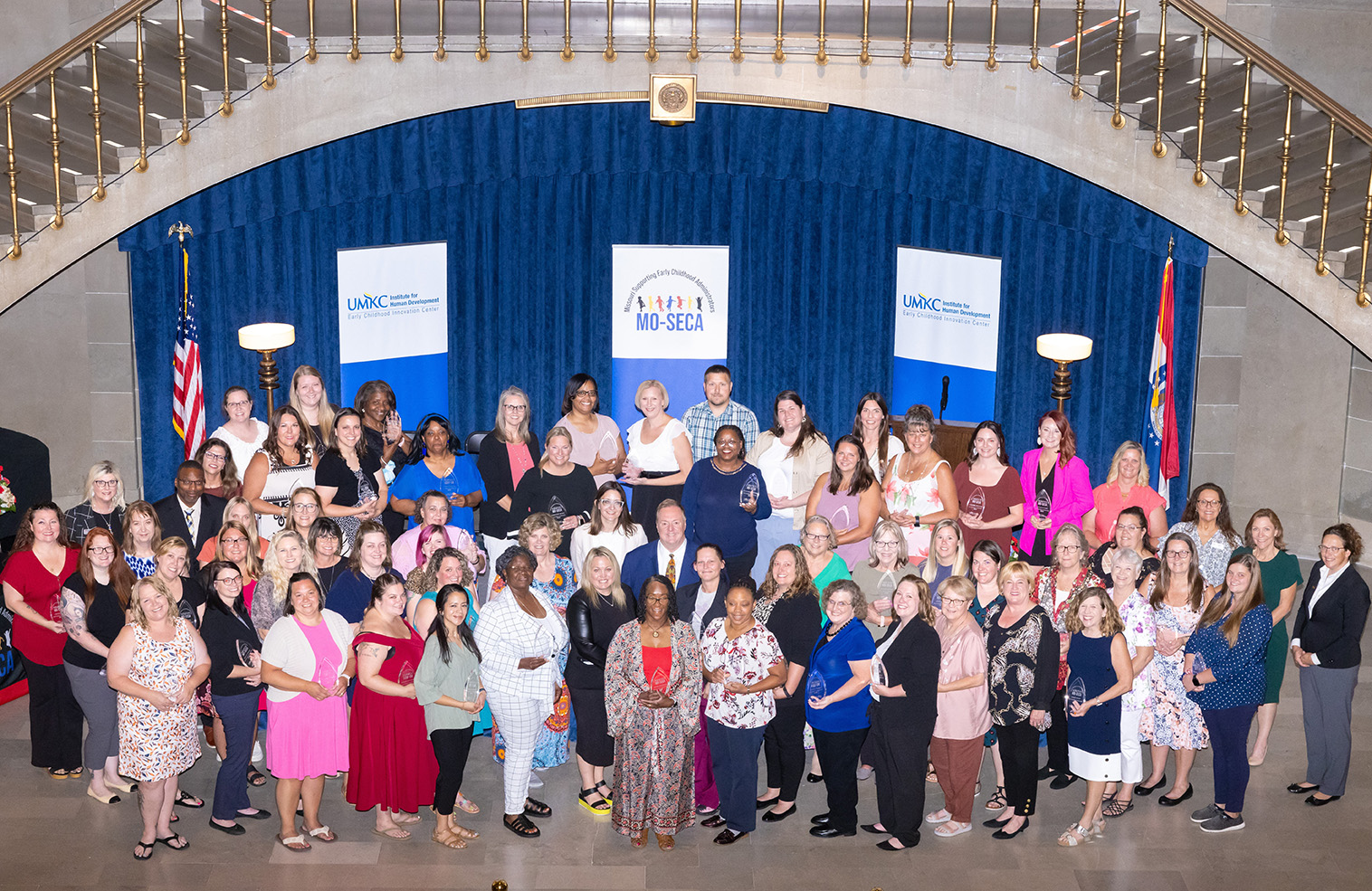 Early childhood administrators from across Missouri take a group photo after receiving honors in the state's capitol rotunda as part of the Missouri Supporting Early Childhood Administrators (MO-SECA) program