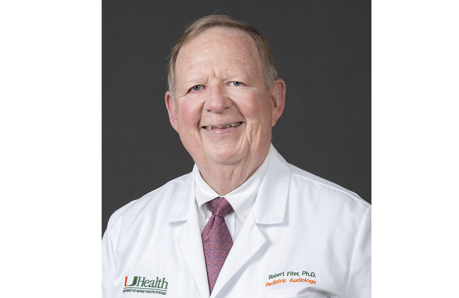 Headshot of Dr. Fifer, a smiling white man with grey hair wearing a lab coat. 