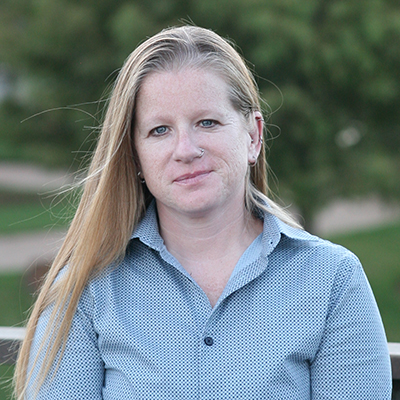 Image of Jennifer Morgan, a white woman with blond hair wearing a blue shirt.